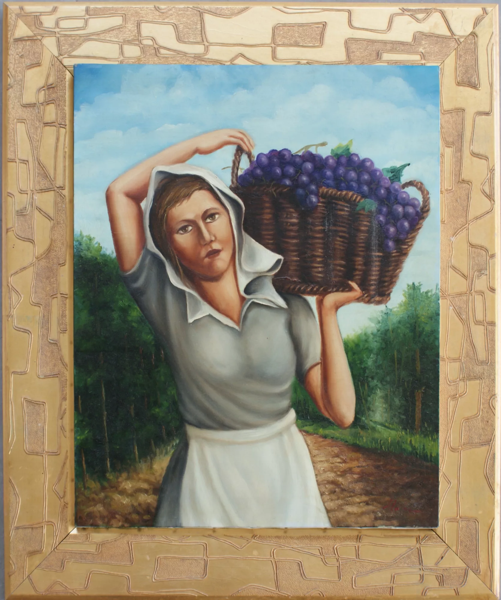 Woman-with-a-basket-of-grapes-Aly-Mohsen "Painting by Aly Mohsen, executed in Oil on canvas (brush). The title is Woman with a basket of grapes and it belongs to the category Once Upon a Time. With Woman with a basket of grapes, Aly Mohsen offers a rigorous and authentic depiction of rural life, positioning the work within the European figurative painting tradition devoted to agricultural labor and the dignity of everyday gestures. The scene portrays a female figure captured in forward motion along a countryside path, carrying a basket filled with grapes—an enduring symbol of the harvest, natural cycles, and agrarian continuity. The composition is centered and stable, built around the solid presence of the woman, who occupies the pictorial space with balance and restraint. The body posture, weight distribution, and composed facial expression convey a representation free from idealization, firmly grounded in the reality of rural labor. The surrounding landscape, defined by vegetation and natural light, actively contributes to the narrative structure, reinforcing a sense of equilibrium and authenticity. Mohsen’s realist figurative approach is marked by careful anatomical rendering, attention to painterly materiality, and chromatic clarity. The palette, based on harmonious greens and warm tones, engages in measured dialogue with the deep purples of the grapes, creating a coherent visual contrast that guides the viewer’s gaze without rhetorical emphasis. Diffused light enhances the calm, timeless atmosphere of the scene. The painting is presented within an original, sober, finely crafted gilded frame, which strengthens its exhibition and museum character, establishing a formal dialogue between the refined frame and the simplicity of the depicted subject."