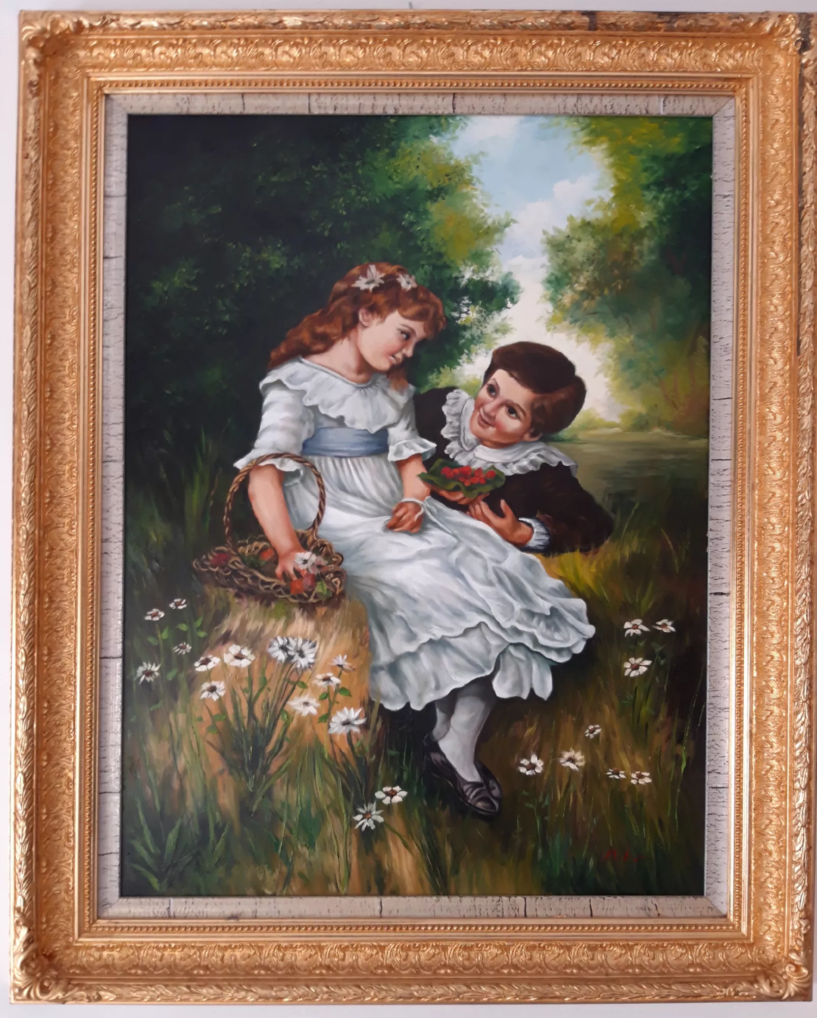 Innocent-love-Aly-Mohsen "Painting by Aly Mohsen, executed in Oil on canvas (brush). The title is Innocent love and it belongs to the category Once Upon a Time. With Innocent Love, Aly Mohsen captures a moment of pure childhood delicacy, transforming a simple gesture into a figurative narrative of universal significance, focused on first emotions and affection free from malice. Set within a serene and luminous natural landscape, the scene portrays two children seated on the grass, suspended between play, emotional awakening, and silent complicity. The girl, dressed in white—a symbolic color of purity and innocence—holds a small basket of flowers, while the boy offers her a red bouquet. This gesture takes on strong symbolic meaning, embodying the act of giving, attention, and the emergence of an emotional bond. Their exchanged gazes form the narrative core of the painting, creating a silent dialogue shaped by trust, tenderness, and mutual respect. The natural setting envelops the figures with balance and restraint, never overpowering them. Soft light, open sky, and gently modulated greenery establish an atmosphere of peace and suspended time, evoking an idealized memory of childhood. Nature thus becomes a protective and symbolic space, the original environment in which feeling arises spontaneously and authentically. From a technical standpoint, Aly Mohsen demonstrates refined mastery of realist figurative painting: the rendering of fabrics, postures, and facial expressions is precise and sensitive, while brushwork remains soft and controlled. References to classical tradition are evident, yet reinterpreted through a personal and contemporary visual language. The work is completed by an original, wide, finely carved gilded frame, which enhances the painting’s museum-quality presence and formal elegance, creating a refined contrast with the intimacy and simplicity of the depicted subject."