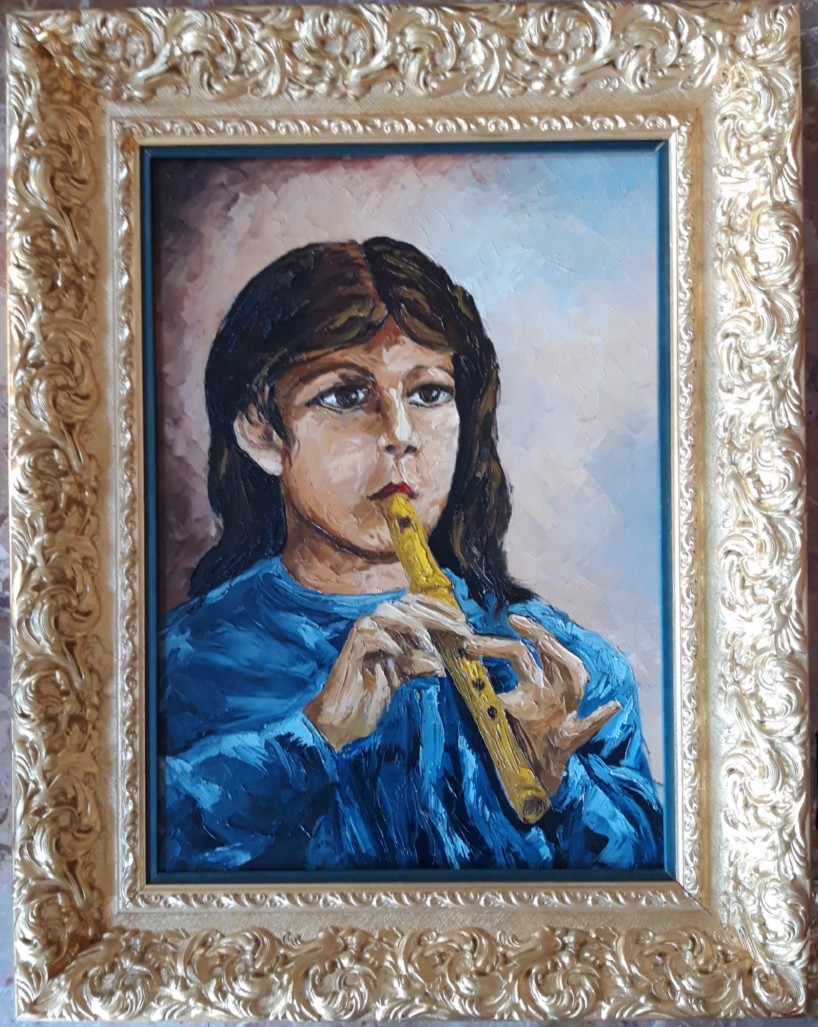 Carnival-piper-with-palette-knife-Aly-Mohsen "Painting by Aly Mohsen, executed in Oil on canvas (palette knife). The title is Carnival piper with palette knife and it belongs to the category Portraits. In Carnival piper with palette knife, Aly Mohsen portrays a symbolic figure of Italian popular tradition, transforming a festive moment into an image of strong intensity and timeless presence. The young musician is depicted frontally while playing the pipe, her focused and absorbed gaze conveying the seriousness and dignity of the musical act. The figure stands out powerfully against a bright, vibrating background executed with a palette knife technique, which gives the surface a pronounced material energy. This textured treatment contrasts with the face and hands, modeled with more controlled and expressive brushwork. The deep blue of the garment dominates the composition, engaging in dialogue with the warm yellow of the instrument and directing the viewer’s attention toward the emotional core of the work: breath, sound, and the act of playing itself. The piper’s face is not idealized but rendered with expressive sincerity, evoking authenticity and a sense of belonging to tradition. The energetic and gestural handling of paint recalls the rhythm and movement of music, suggesting the lively atmosphere of the Ivrea Carnival without relying on literal narrative details. The wide, finely crafted gilded frame creates a refined contrast with the painting’s expressive force, elevating the popular scene to an image of cultural significance and granting it a solemn, museum-like presence. The frame enhances the dialogue between painterly energy and classical presentation, situating the folkloric subject within the broader European pictorial tradition. An original figurative work by Aly Mohsen, Carnival piper with palette knife forms part of his ongoing exploration of collective memory, local traditions, and the centrality of the human figure, distinguished by strong visual identity, material vitality, and expressive depth."